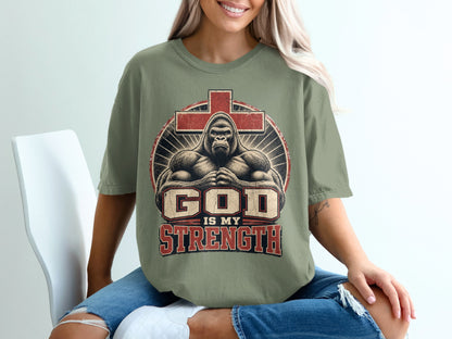 T-shirt with graphic of gorilla, cross, and text "God is My Strength."