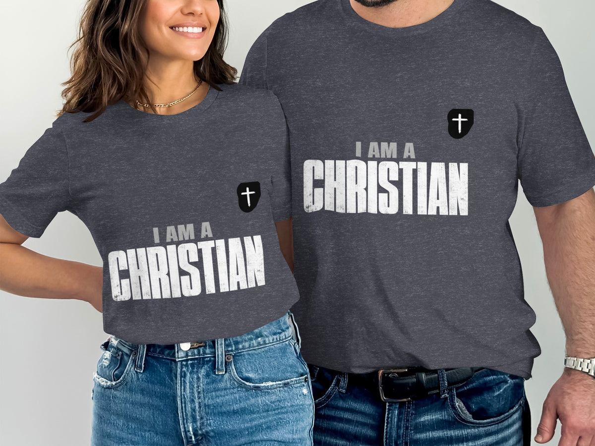 Two people wearing dark grey t-shirts with white text reading "I AM A CHRISTIAN".