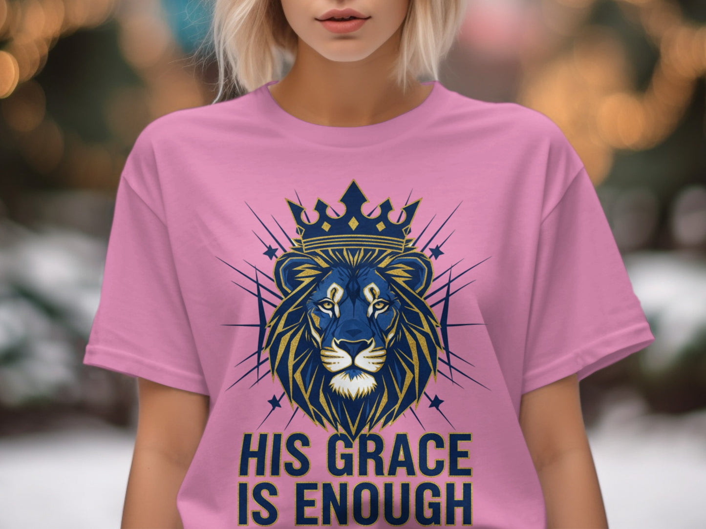 Pink t-shirt with crowned lion graphic and "His Grace Is Enough" text.