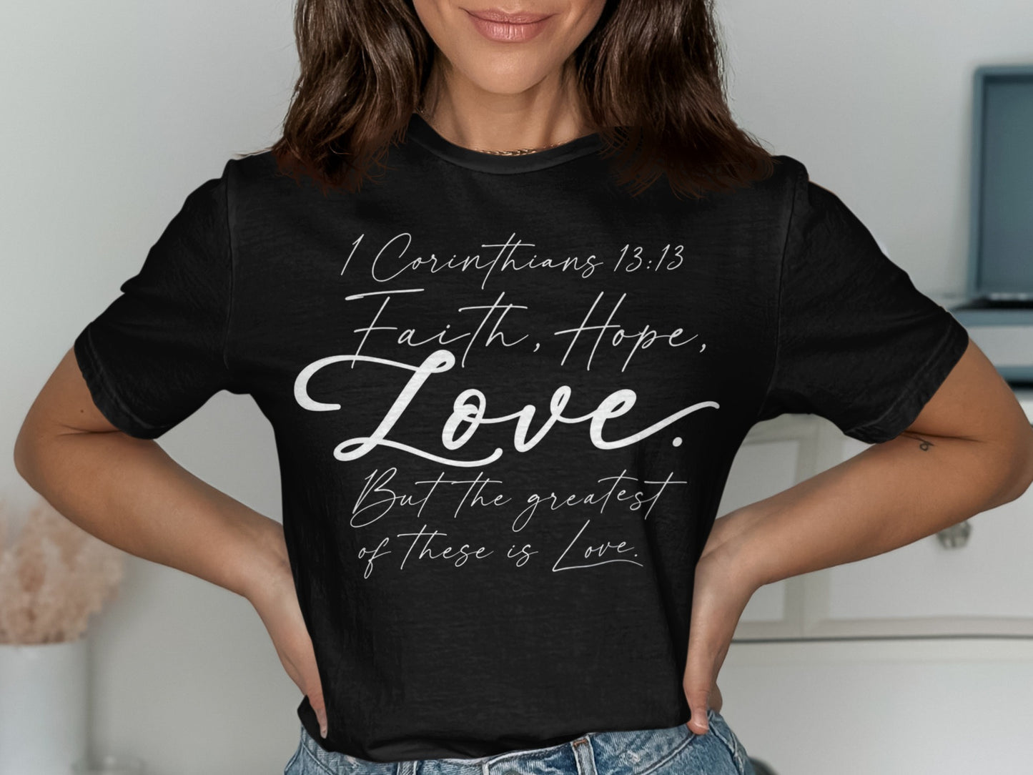 Black t-shirt with "1 Corinthians 13:13 Faith, Hope, Love. But the greatest of these is Love."