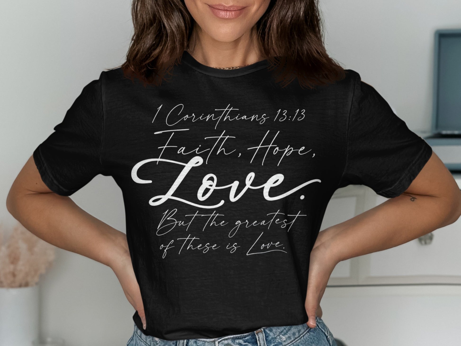 Black t-shirt with "1 Corinthians 13:13 Faith, Hope, Love. But the greatest of these is Love."
