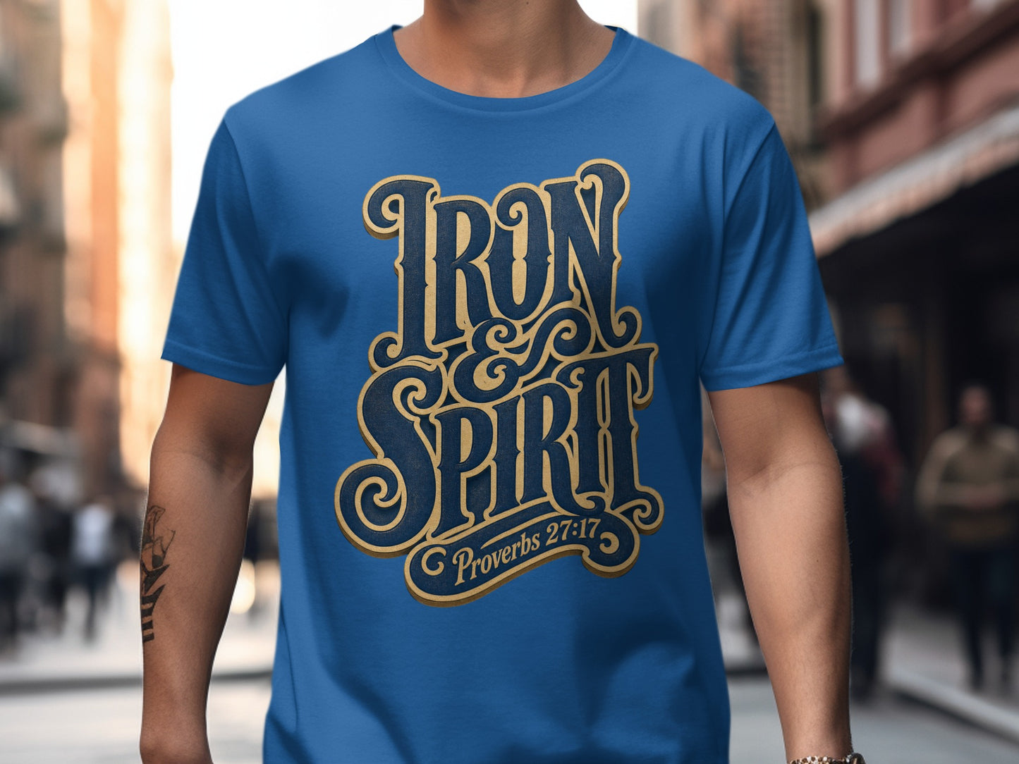Blue t-shirt with "Iron & Spirit" and "Proverbs 27:17" text graphic.