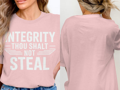 Pink t-shirt with white text "INTEGRITY THOU SHALT NOT STEAL" on front.