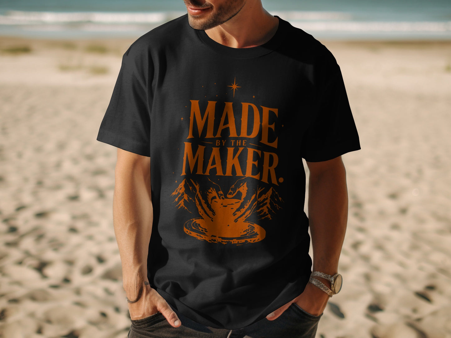 Black t-shirt with orange "MADE BY THE MAKER" text and pottery imagery.