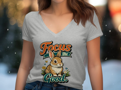 Grey v-neck t-shirt with a cartoon rabbit graphic and "Focus the Good" text.