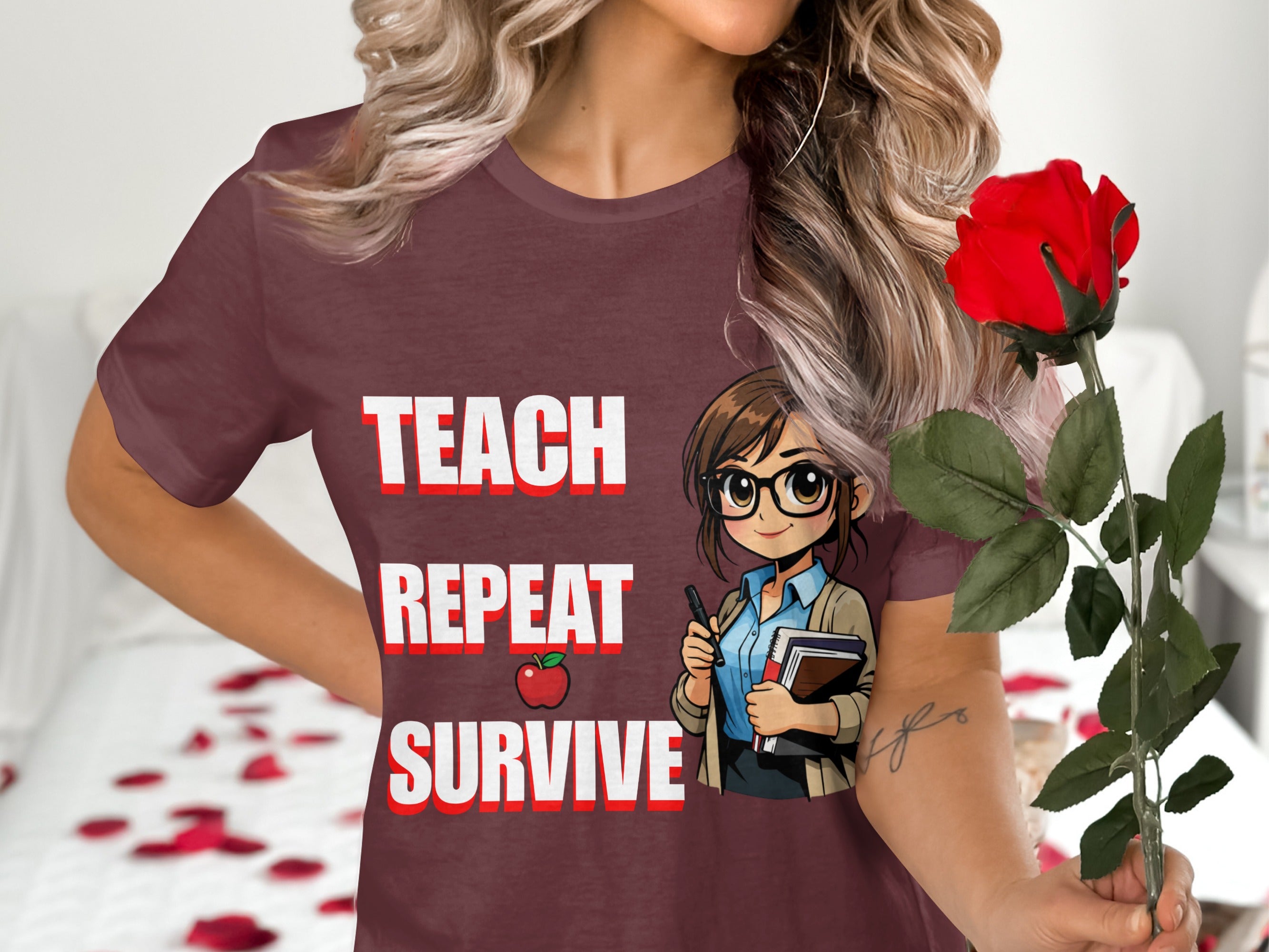 Maroon t-shirt with "Teach Repeat Survive" text, an apple, and cartoon teacher illustration.