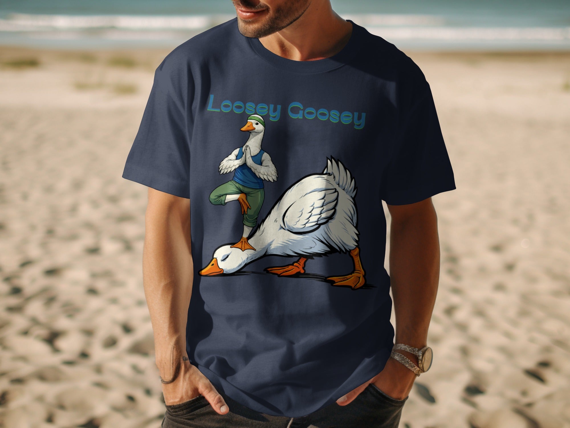 Navy t-shirt with "Loosey Goosey" text and cartoon geese doing yoga on a beach.