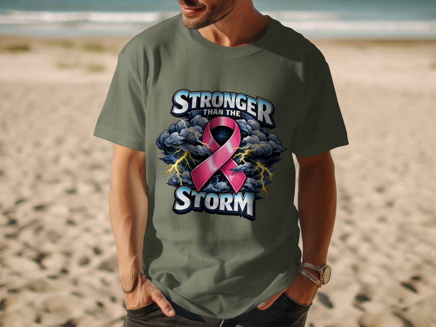 Olive green t-shirt with pink ribbon and text "Stronger than the Storm".