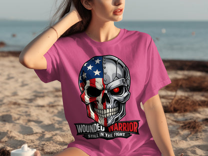 Pink t-shirt with a graphic of a skull, half American flag, half metallic with a red eye