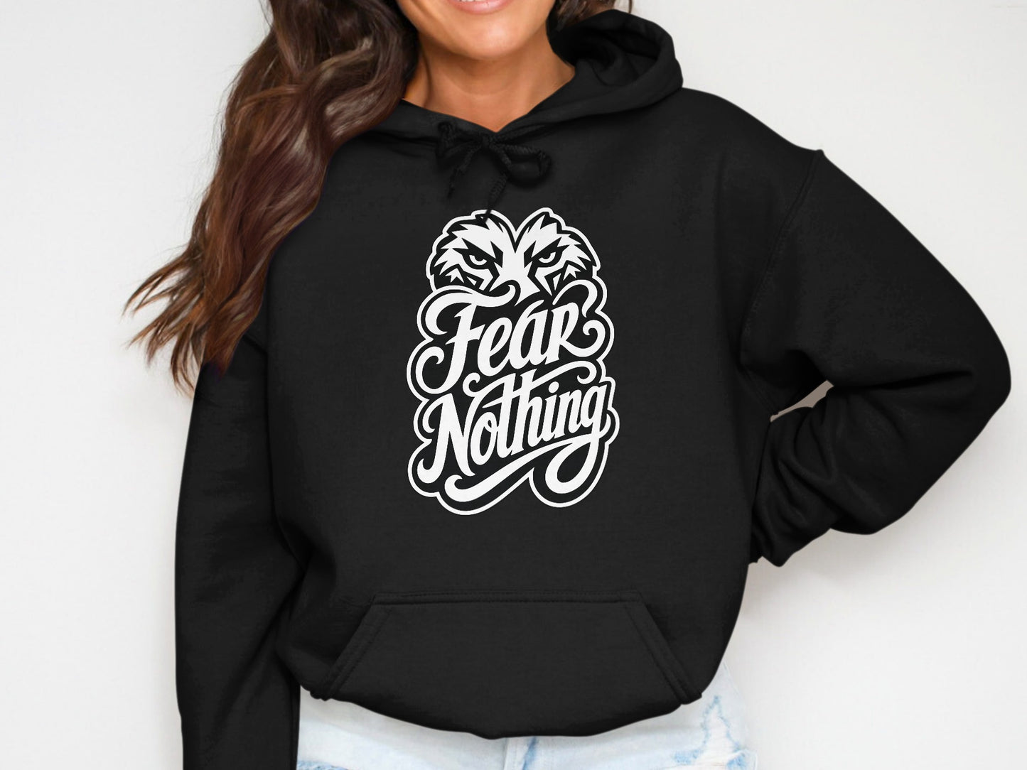 Black hoodie with white graphic text "Fear Nothing" and wolf's head.