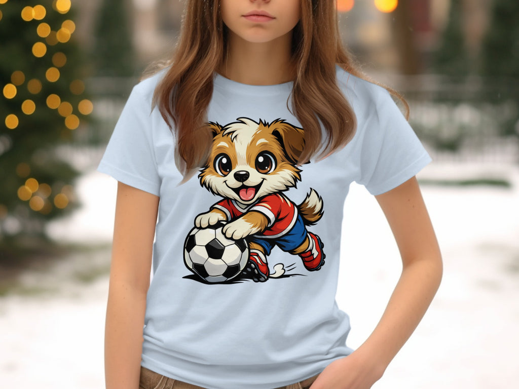 Cartoon dog wearing red shirt and blue shorts kicks soccer ball on a light blue shirt.
