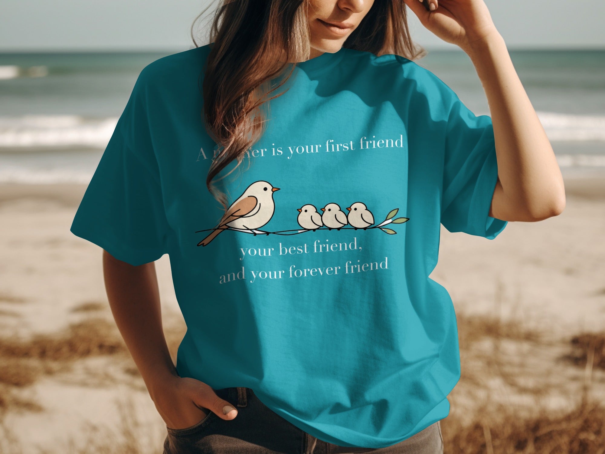 "A 'sister is your first friend, your best friend, and your forever friend" graphic on a teal shirt.
