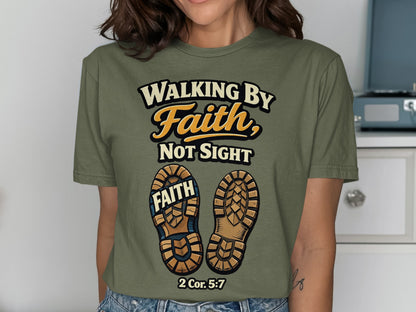 Green t-shirt with "Walking by Faith, Not Sight" text and boot soles.