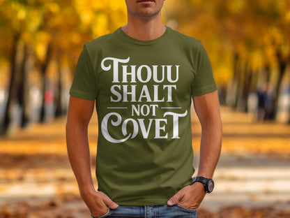 Olive green t-shirt with white text "THOU SHALT NOT COVE T".