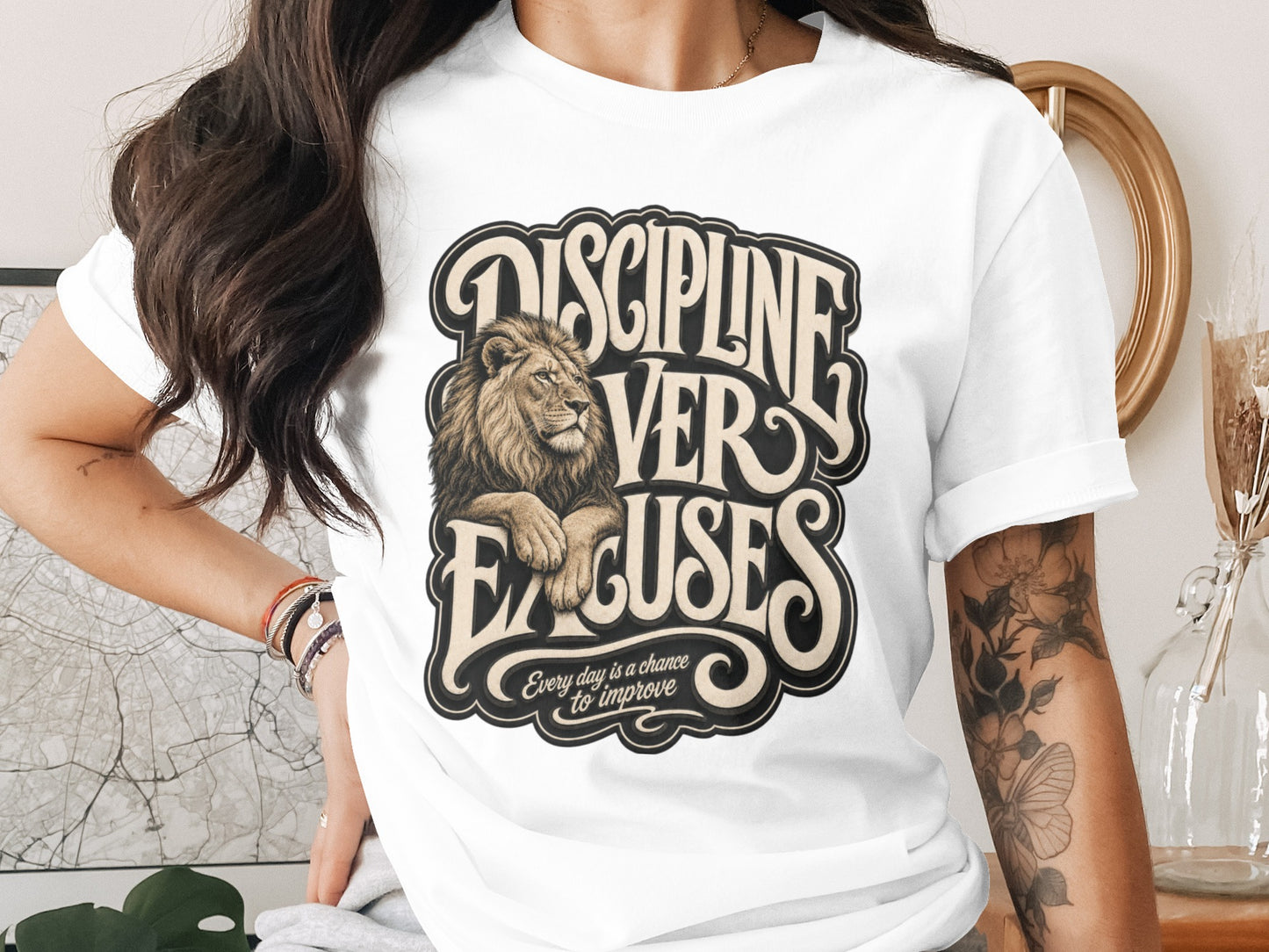 White t-shirt with "DISCIPLINE VER EXCUSES" text and a lion graphic.