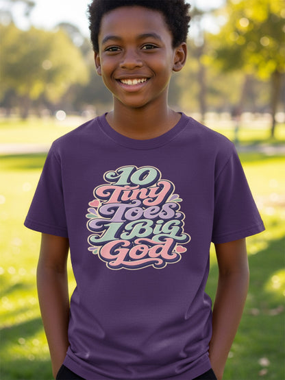The purple t-shirt has the text "10 Tiny Toes Big God" with pastel colored lettering.