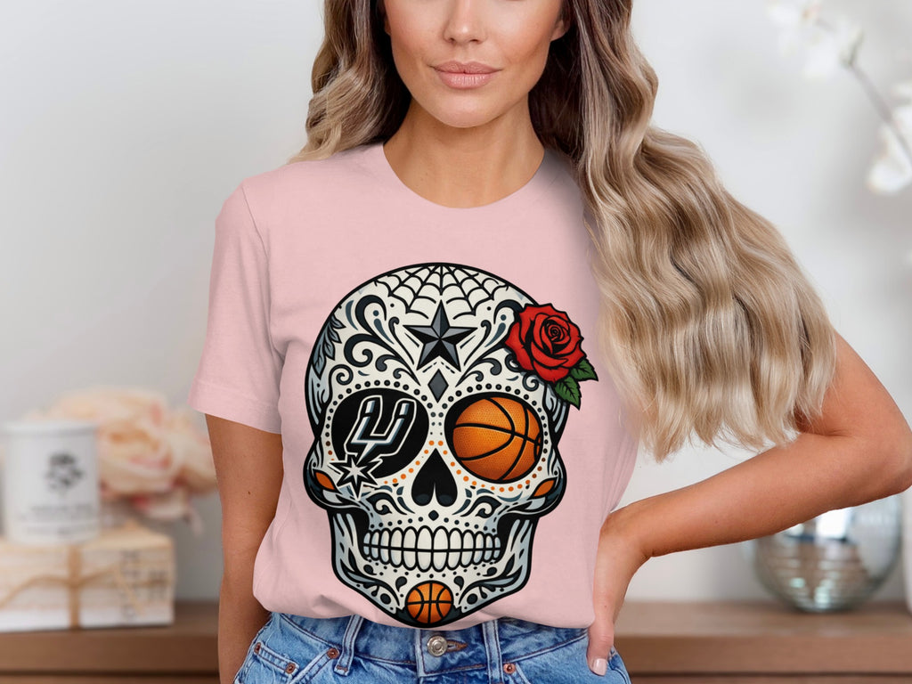 Sugar skull graphic with basketballs and San Antonio Spurs logo on a pink t-shirt.