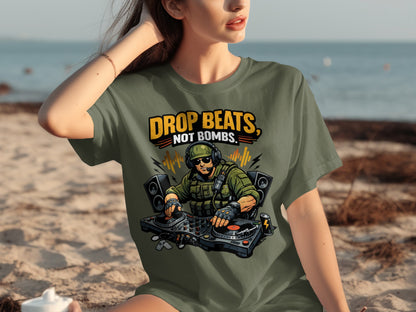 T-shirt graphic with text "Drop Beats, Not Bombs" and a DJ in military gear.