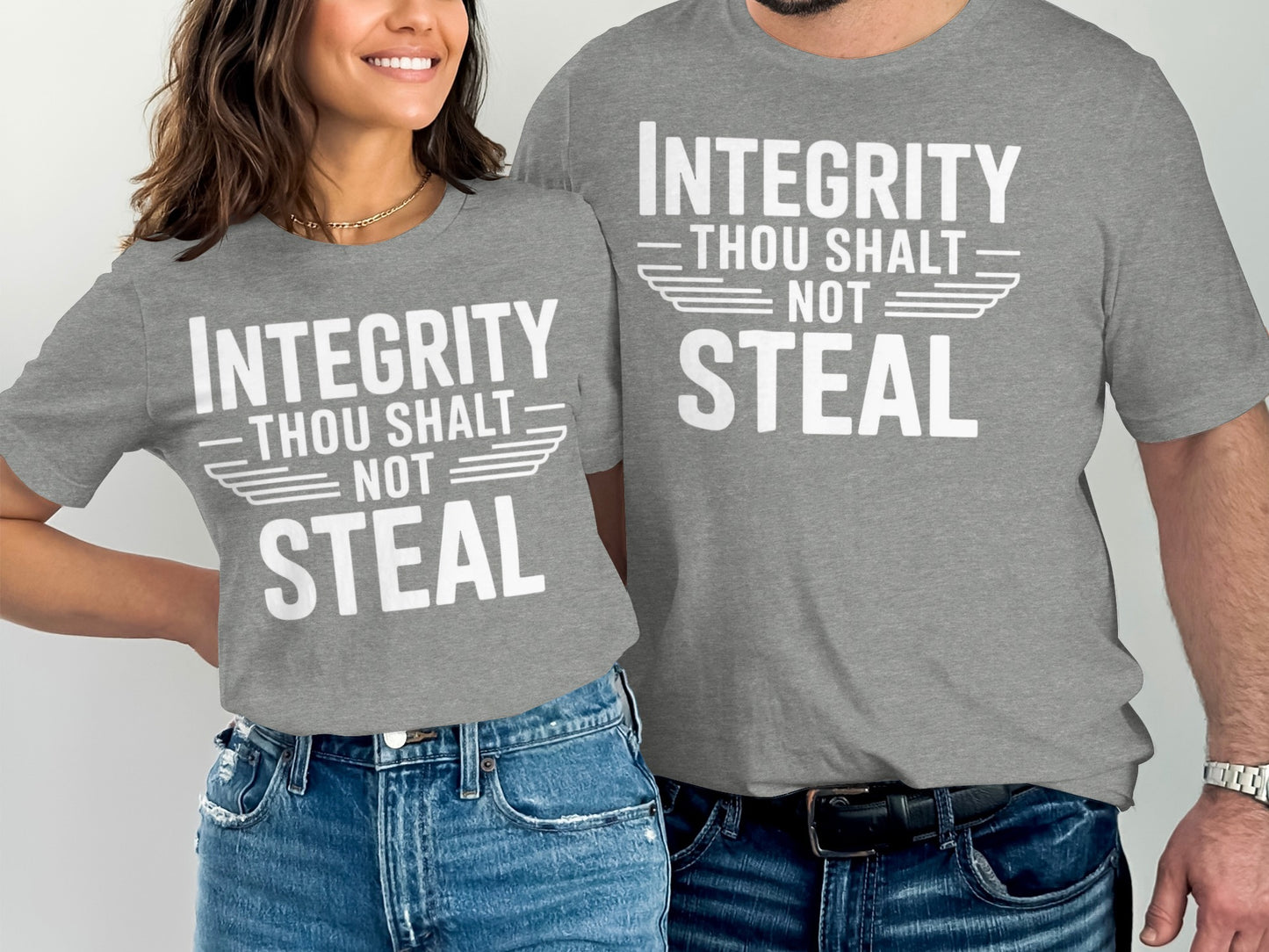 Two people in gray t-shirts with white text "Integrity Thou Shalt Not Steal."