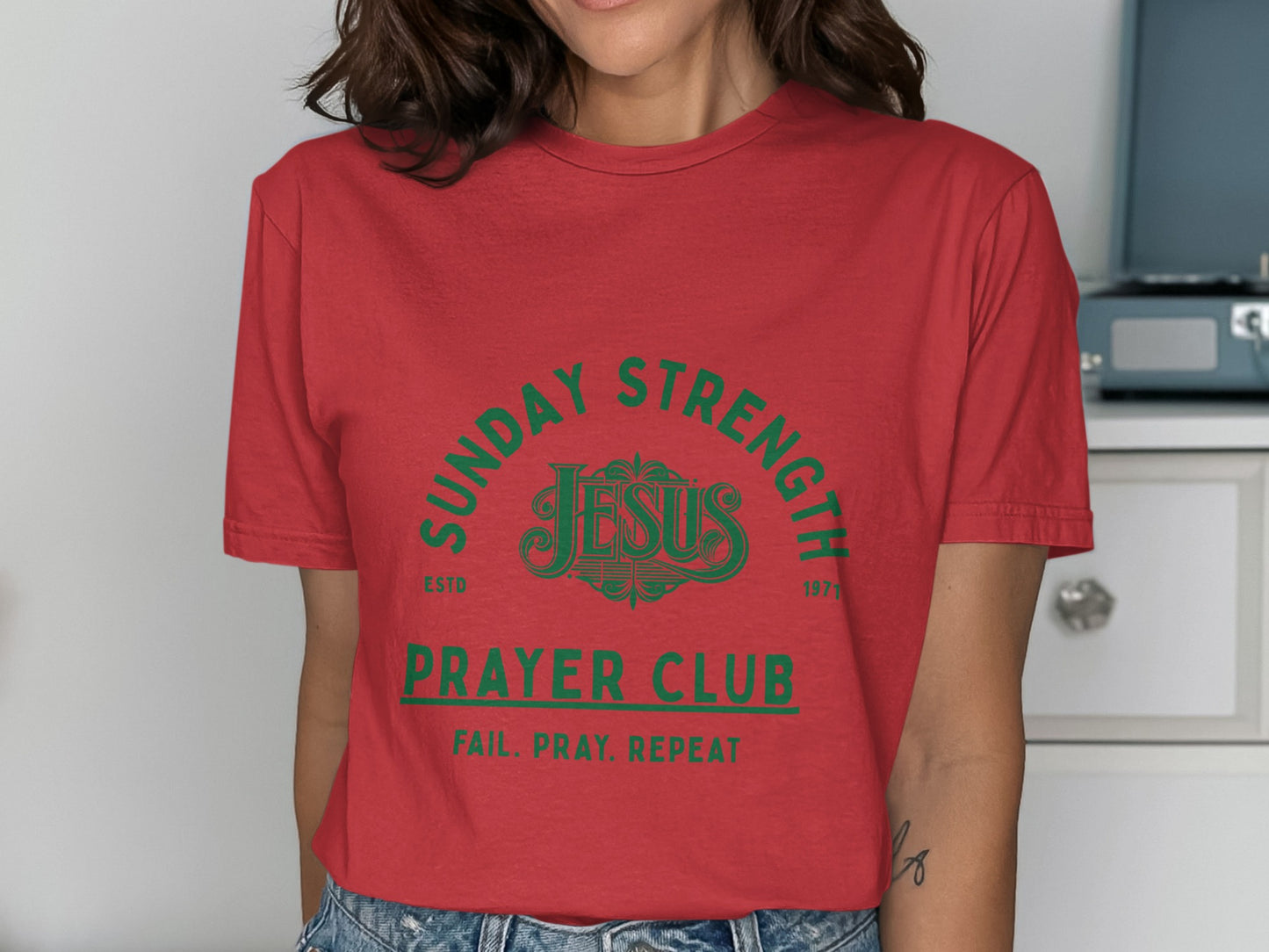 Red t-shirt with green text "Sunday Strength Jesus Prayer Club Fail. Pray. Repeat."