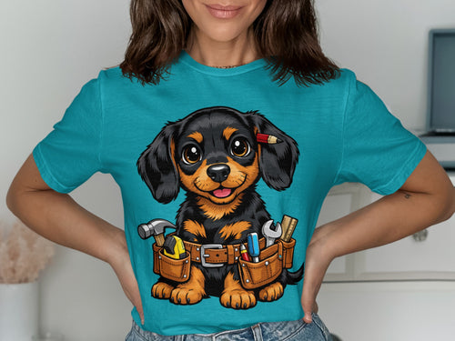 Dachshund puppy wearing a tool belt with hammer, tape measure, wrench, pencil, and ruler.