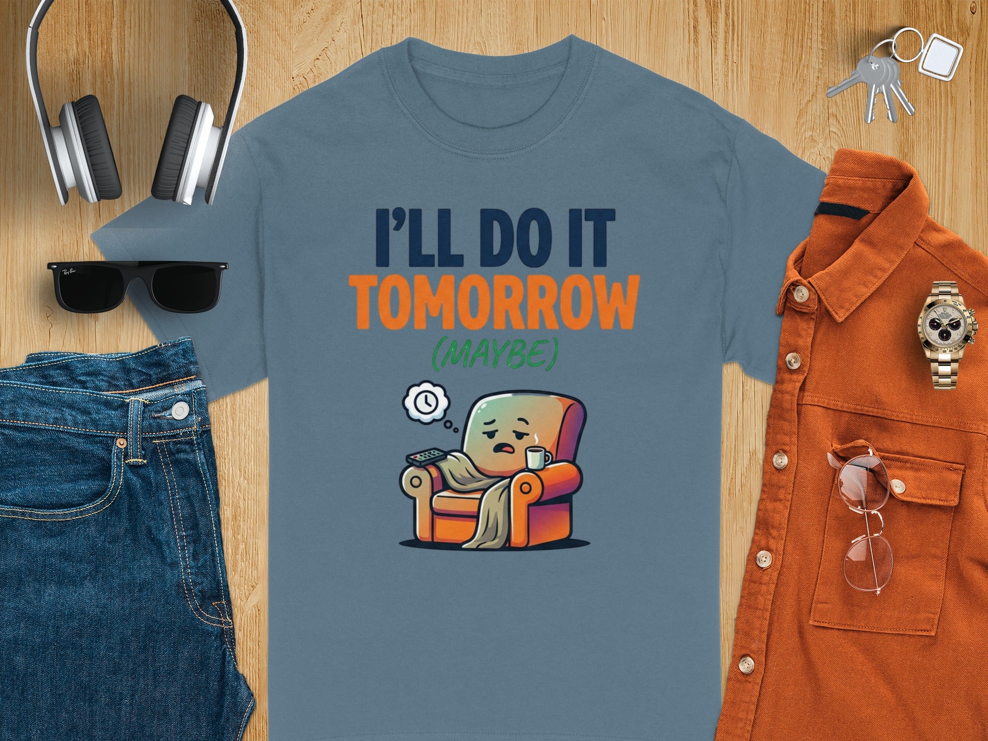 Blue t-shirt with "I'LL DO IT TOMORROW (MAYBE)" text and a lazy armchair graphic.
