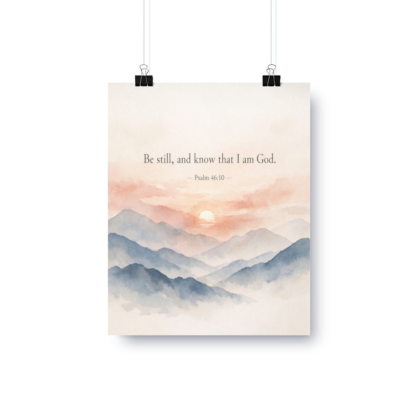 Watercolor mountains at sunrise with text "Be still, and know that I am God. - Psalm 46:10".
