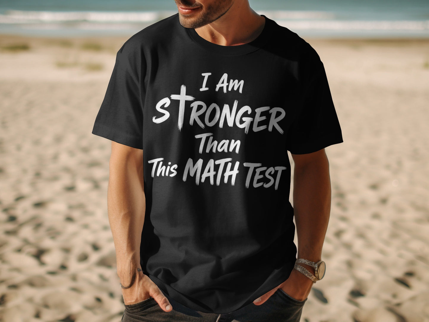 Black t-shirt with text "I Am Stronger Than This Math Test"