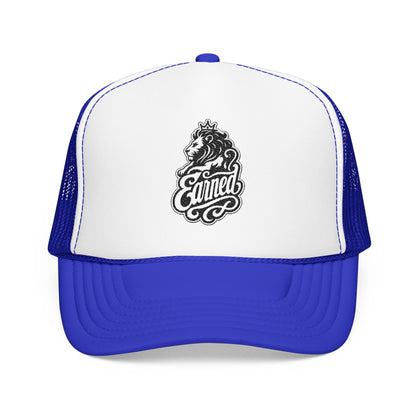 Blue trucker hat with white front and a lion graphic with the word "Earned".