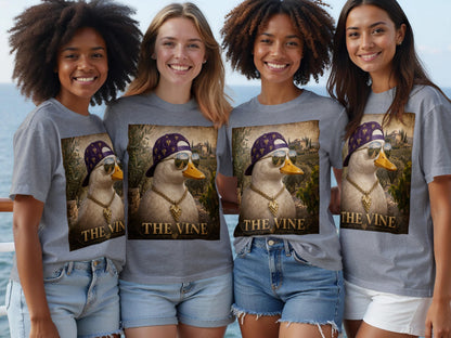 Four women wear grey t-shirts with a graphic of a duck wearing a chain and cap, with text "THE VINE."
