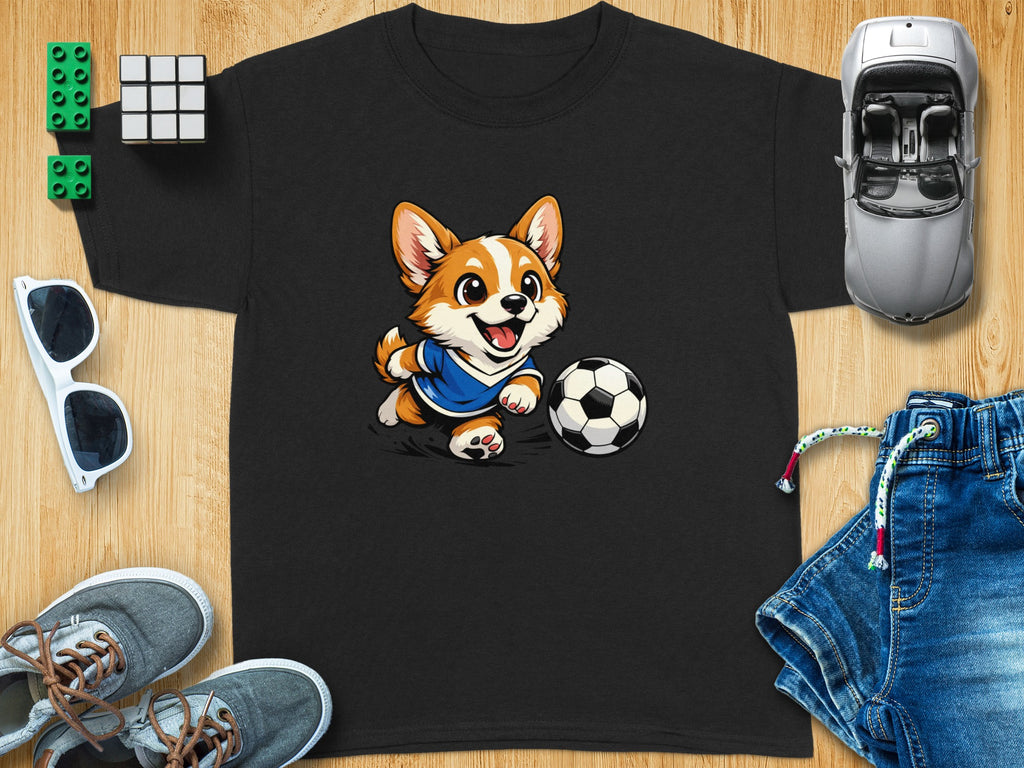 Black t-shirt with cartoon corgi kicking a soccer ball graphic.