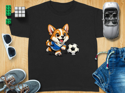 Black t-shirt with cartoon corgi kicking a soccer ball graphic.