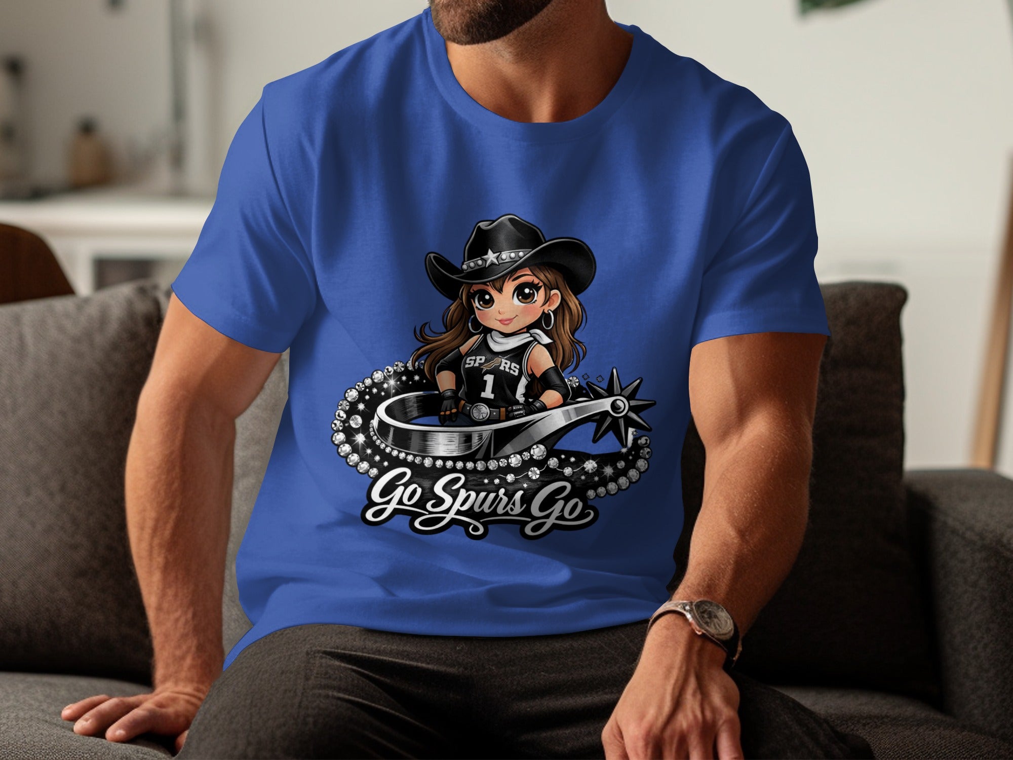 Blue t-shirt with cartoon Spurs mascot wearing a cowboy hat and uniform, with "Go Spurs Go" text.