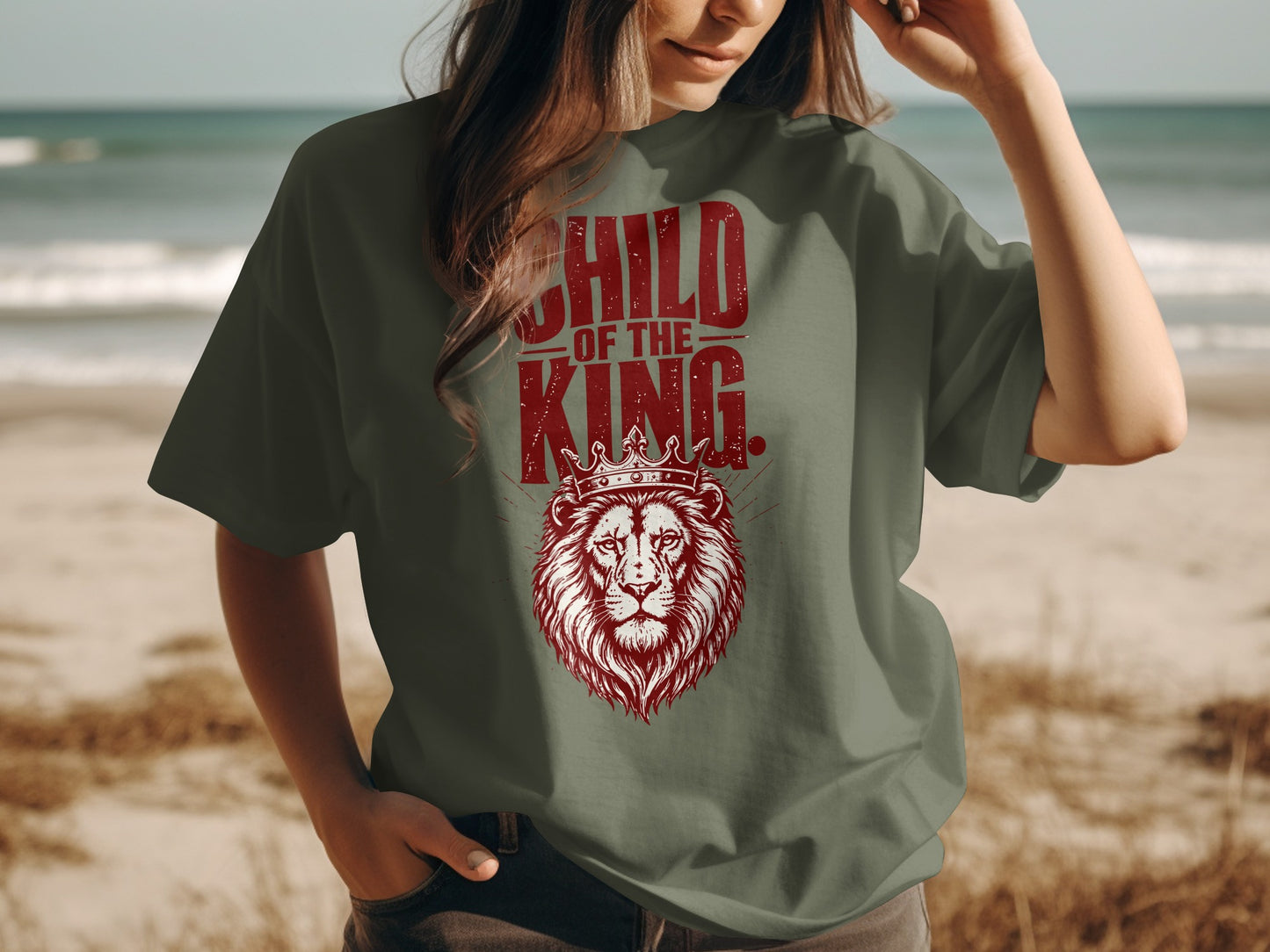 Green t-shirt with a distressed red graphic of a lion wearing a crown and text "CHILD OF THE KING".
