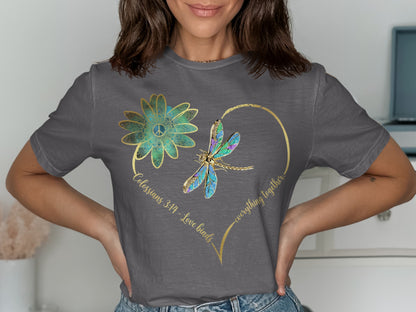Grey t-shirt with a heart design, dragonfly, flower, and text "Colossians 3:14 - Love binds everything together."