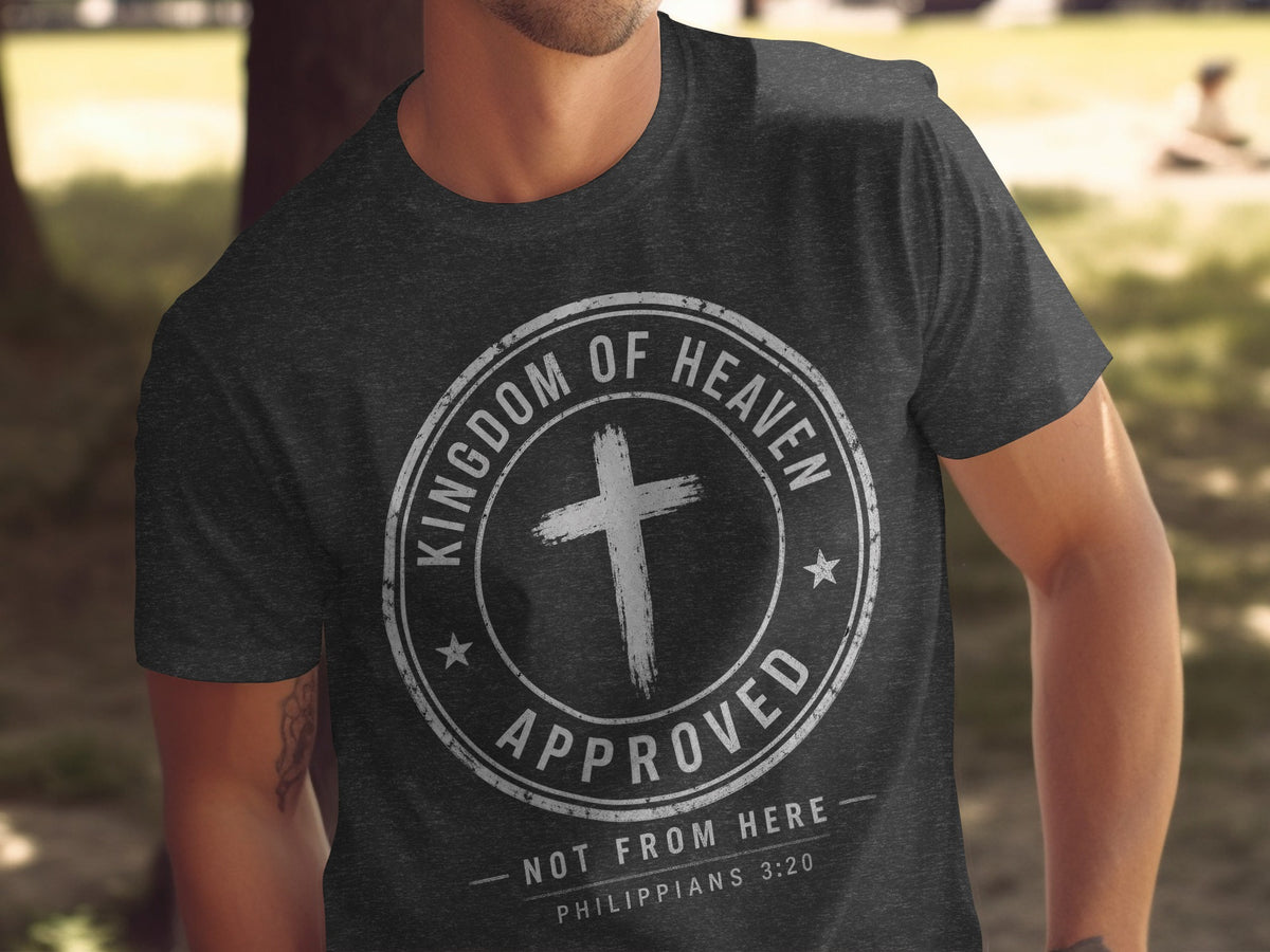 Dark t-shirt with distressed "Kingdom of Heaven Approved" text and cross.