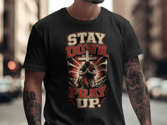 Black t-shirt with "STAY DOWN PRAY UP" text and praying figure graphic.