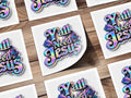 Iridescent "Y'all Needs Jesus" text with clouds and cross on white squares.