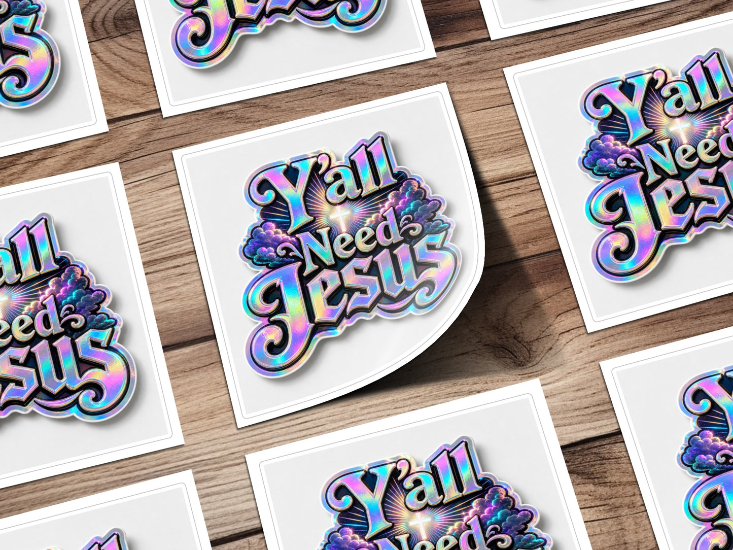 Iridescent "Y'all Needs Jesus" text with clouds and cross on white squares.