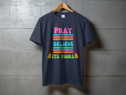 Navy t-shirt with colorful "PRAY BELIEVE ITS YOURS" text and praying hands.