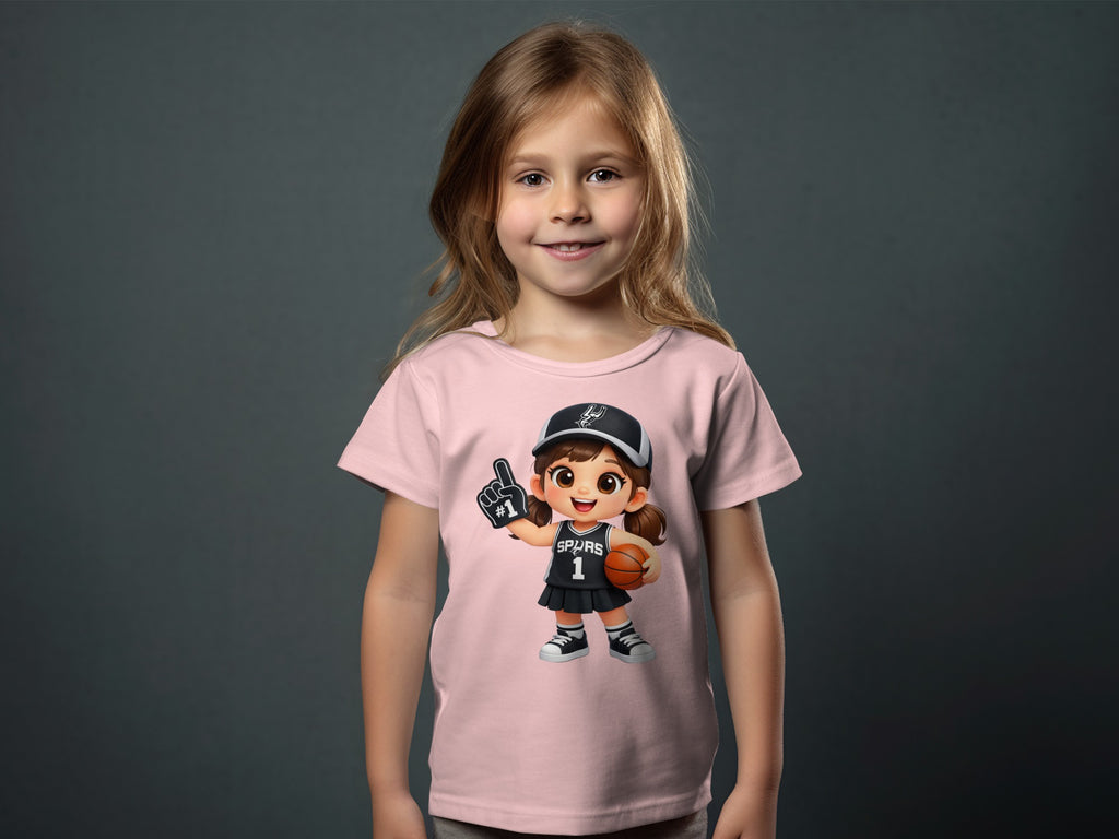 Pink t-shirt with cartoon girl wearing Spurs jersey, #1 foam finger, and basketball.