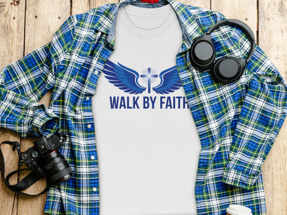 White t-shirt with blue wings and cross graphic, text "WALK BY FAITH".