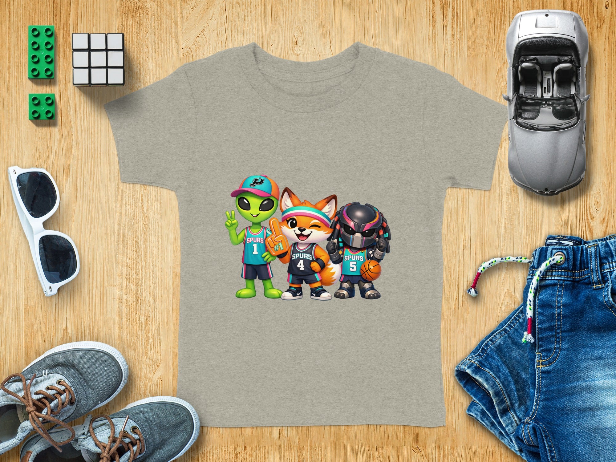 Gray t-shirt with cartoon alien, fox, and predator basketball players.