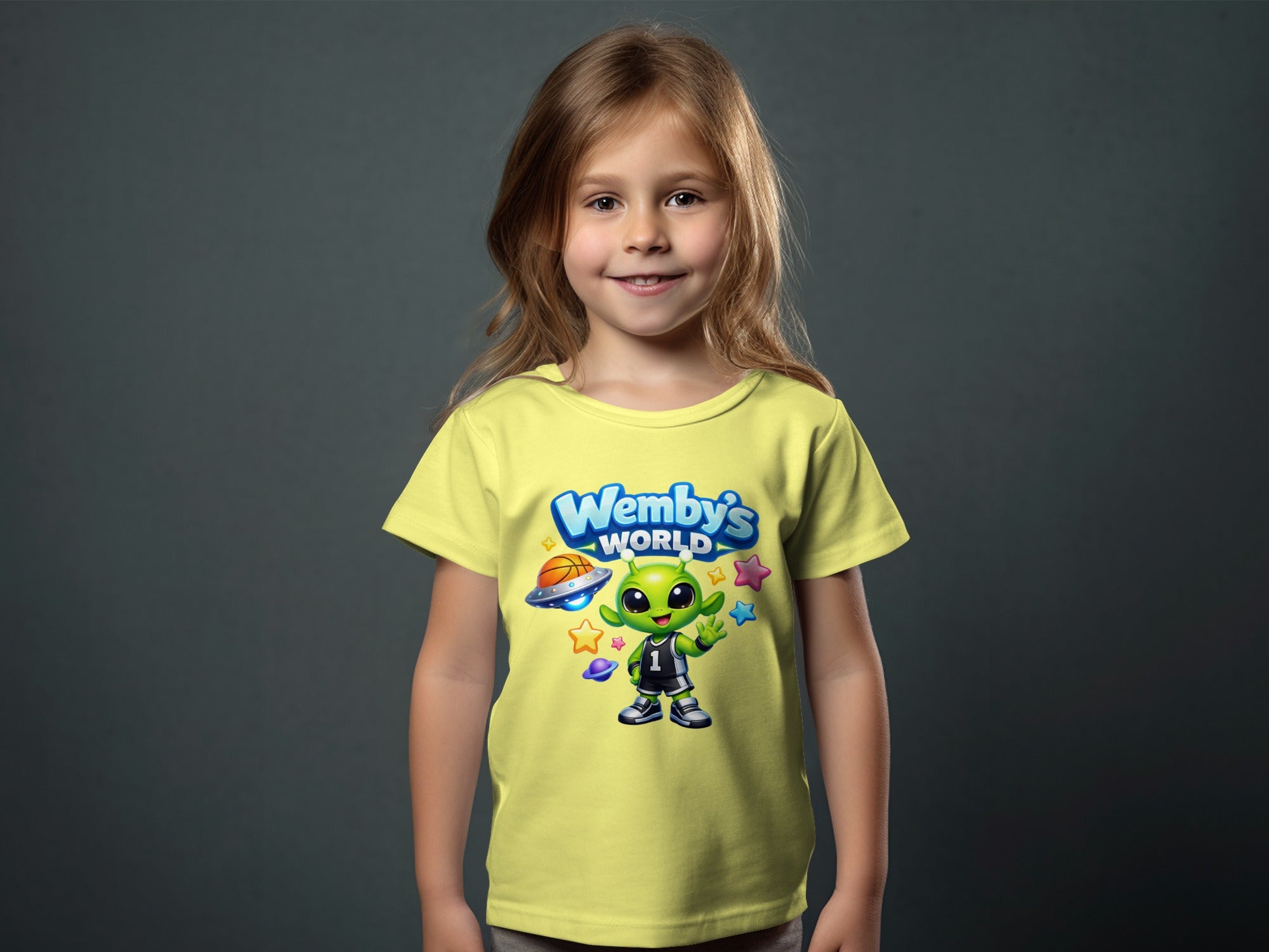Yellow t-shirt with green alien graphic wearing jersey number 1, "Wemby's World" text.