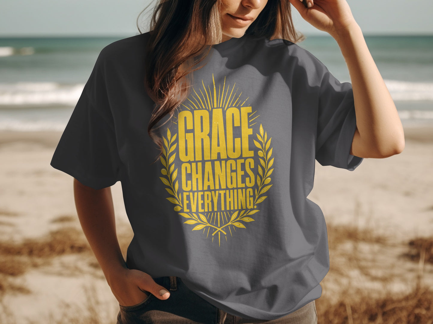 Dark grey t-shirt with yellow text "GRACE CHANGES EVERYTHING" in a laurel wreath.