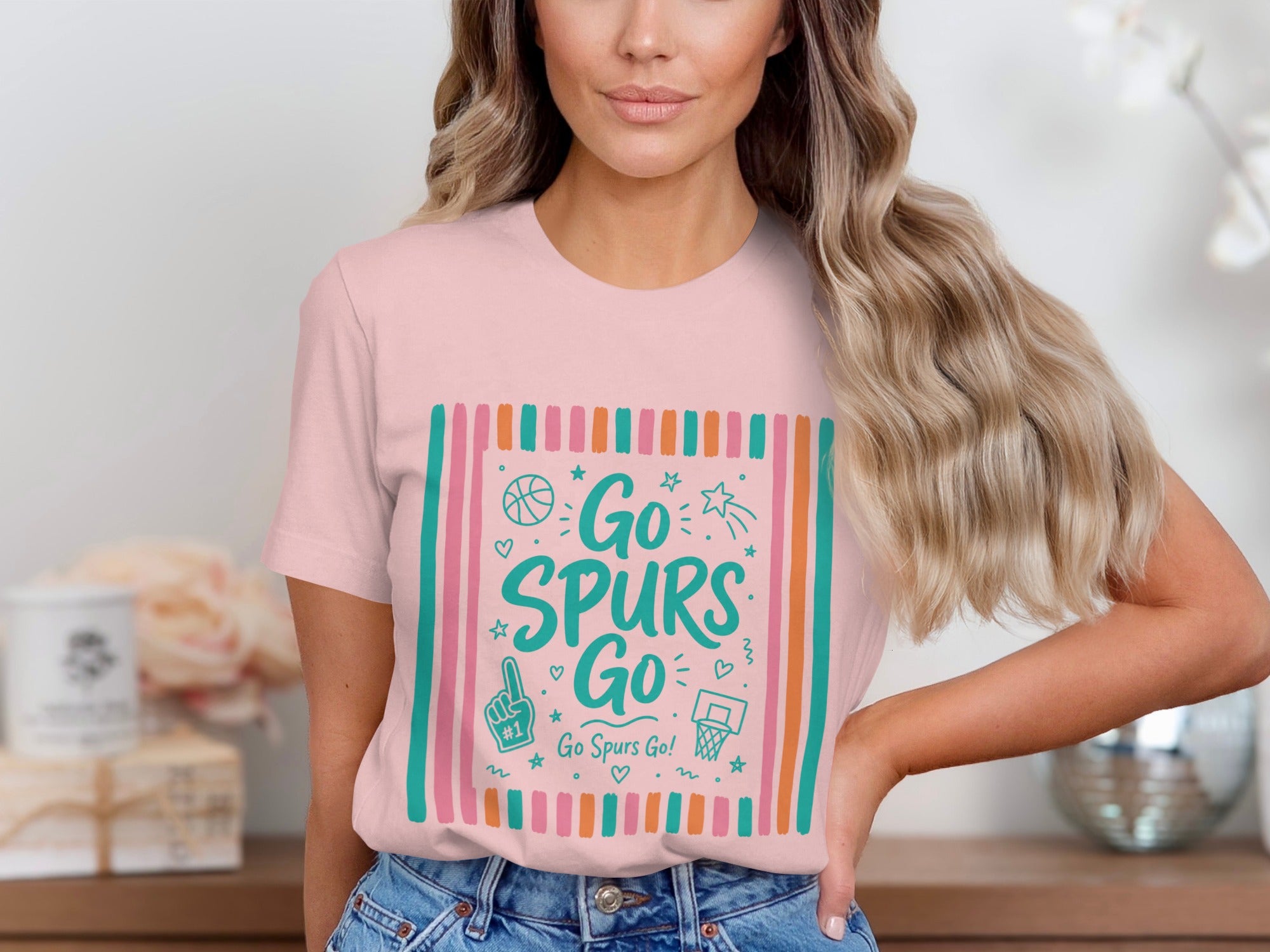 Pink t-shirt with "Go Spurs Go!" text and basketball graphics.