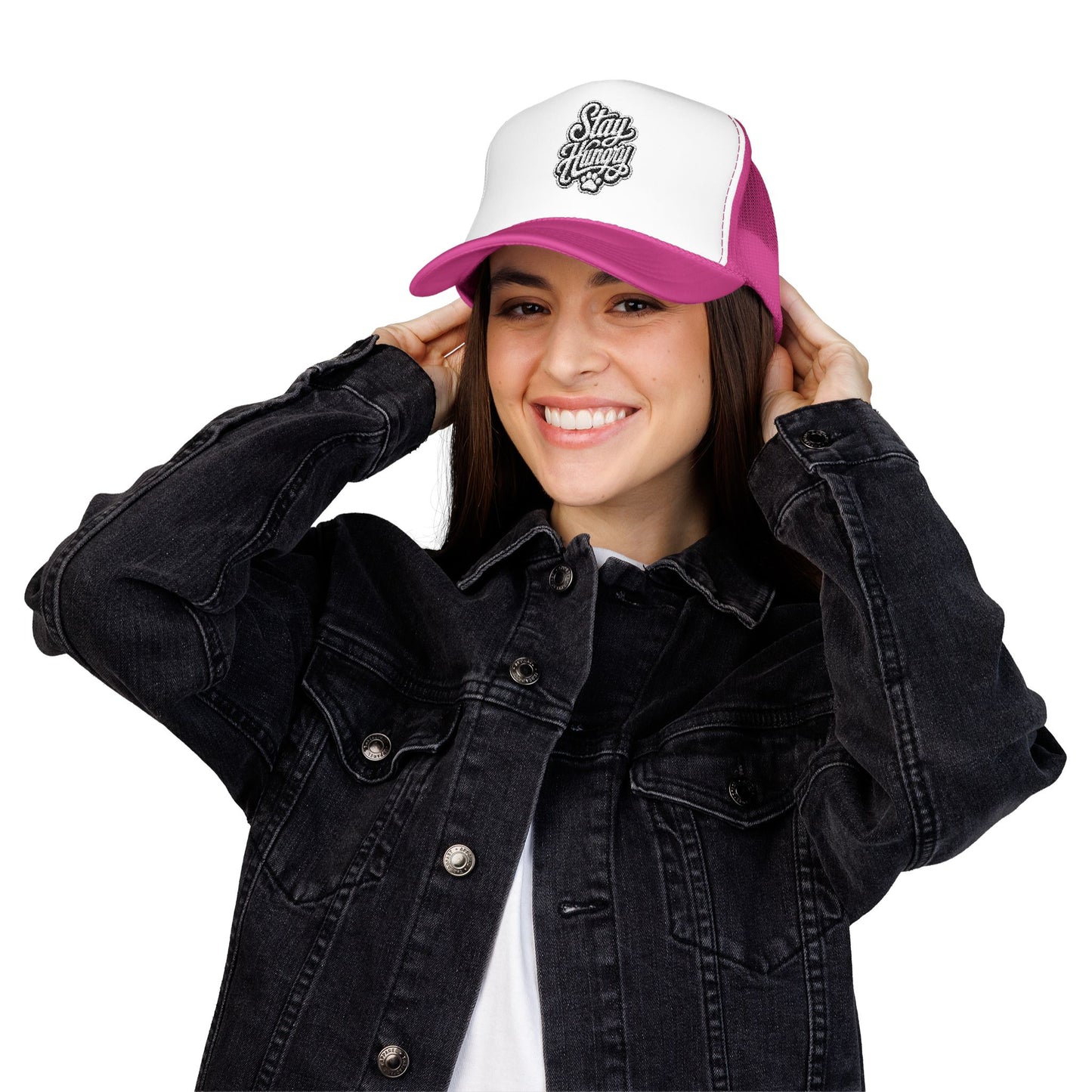 Woman wearing a pink and white trucker hat with "Stay Hungry" text.