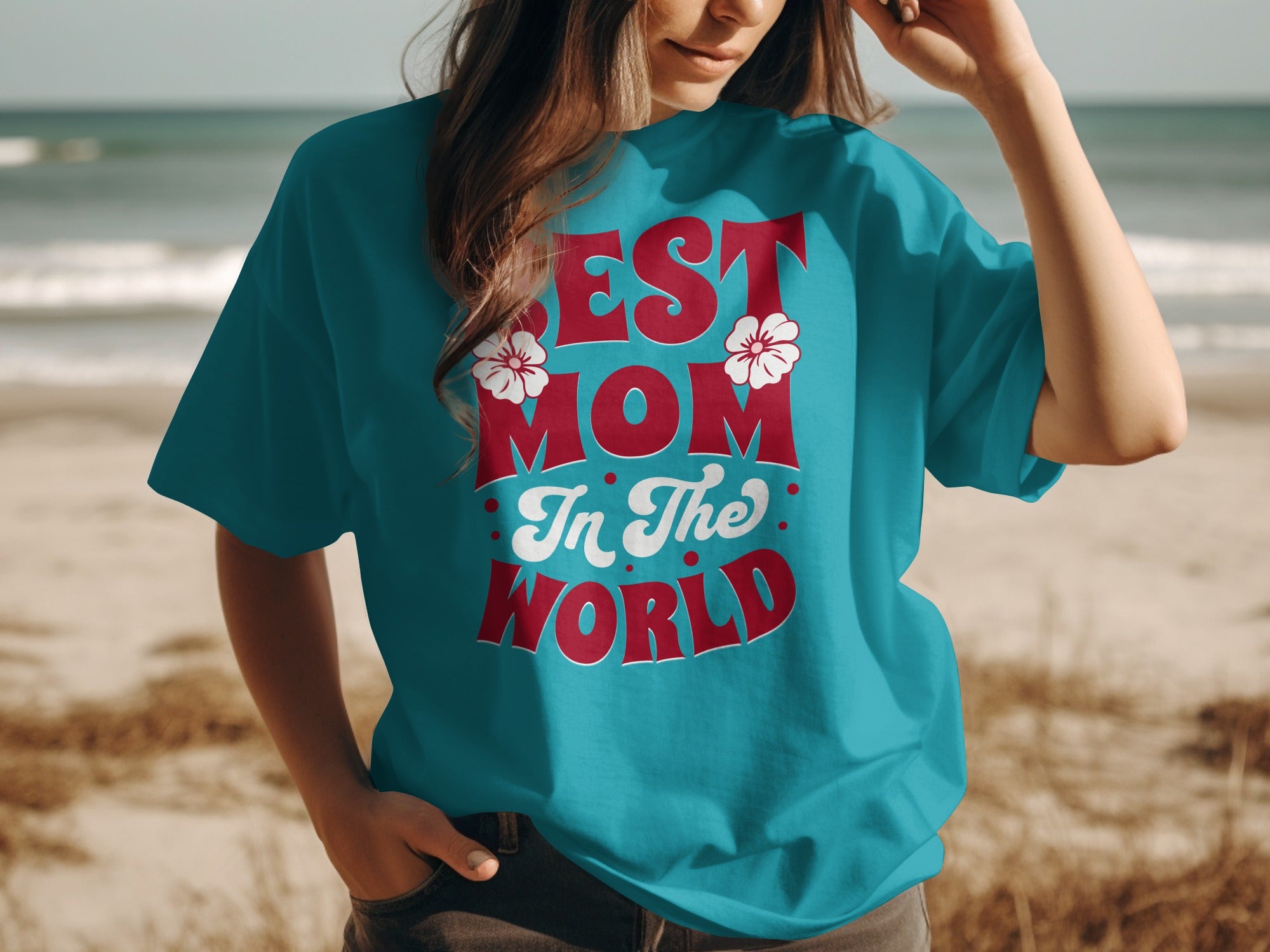 Teal t-shirt with "Best Mom In The World" text and floral accents.