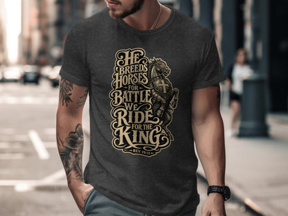 Dark grey t-shirt with "He breeds horses for battle, we ride for the King" and "Rev 19:11" text.