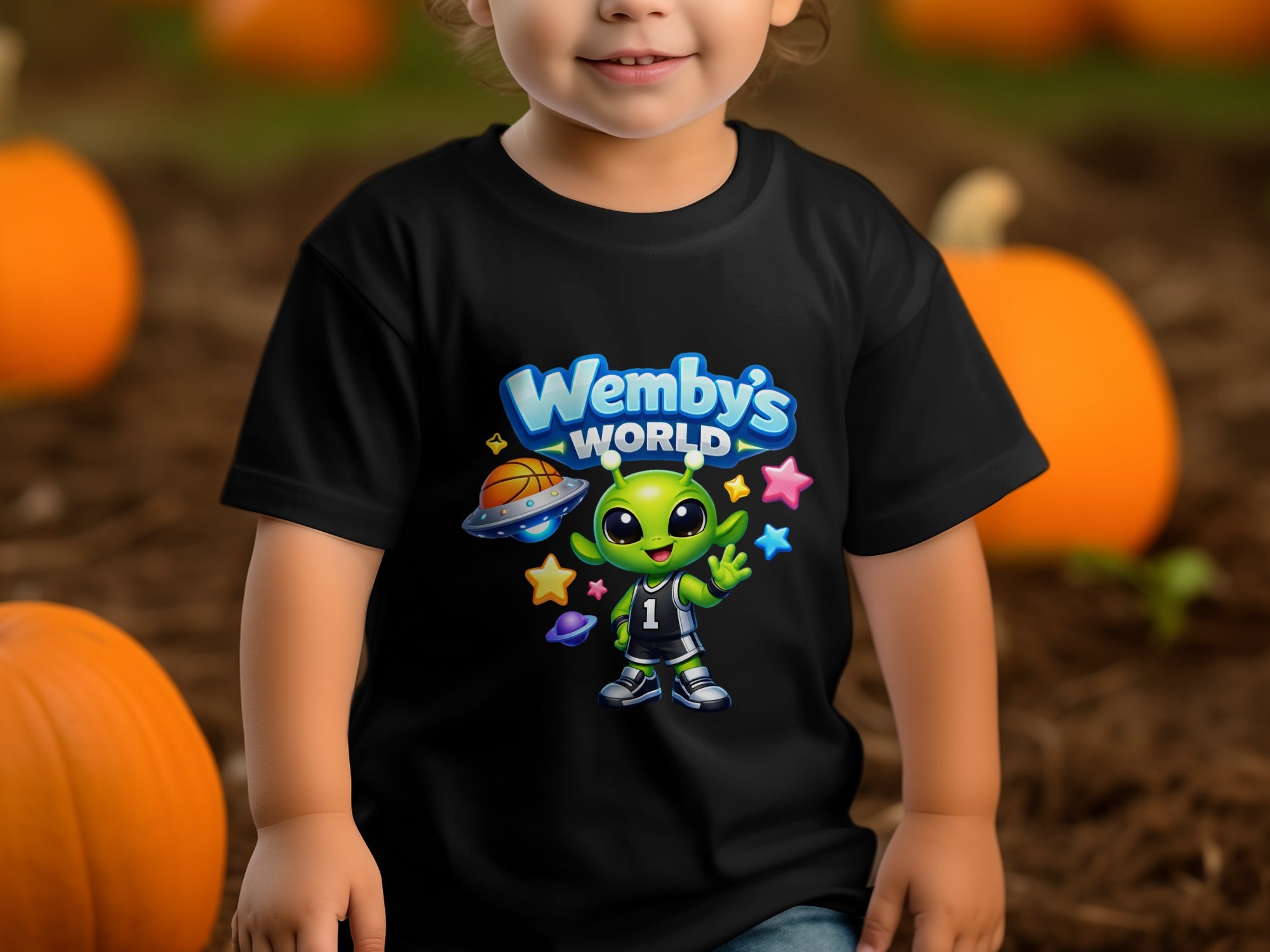 Black t-shirt with "Wemby's WORLD" logo and a cartoon alien playing basketball.